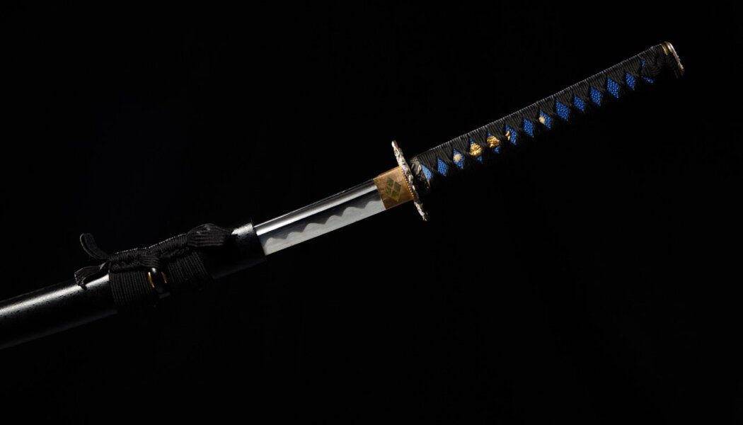 Japanese katana samurai sword hang in air over Black background isolated.
